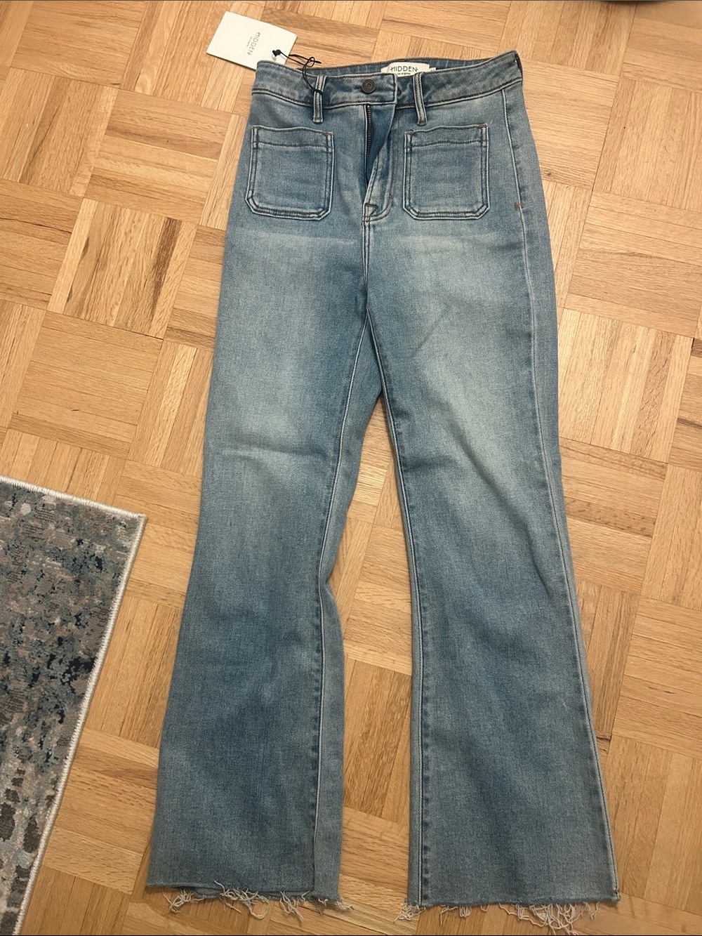 High-Rise Light Blue Flare Jeans with Front Patch Pockets